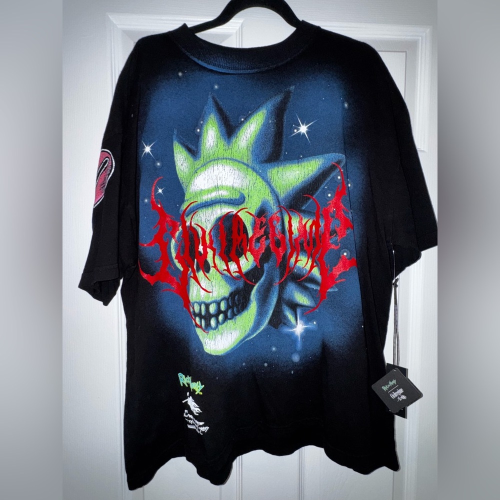 Black Graphic Tee with Green and Red Skull Design